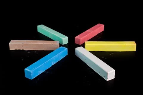 Colored chalk on a blackboard background Stock-Fotos