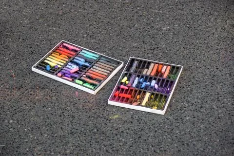 Colored chalks. Colored chalk on playground with drawings on street Stock Photos