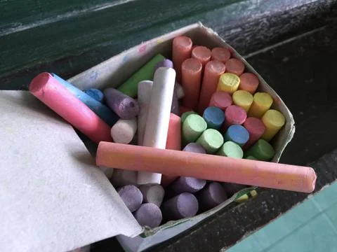 Colored Chalks in a Paper Box Stock Photos