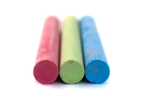 Colored chalks on white background with soft shadows Stock-Fotos
