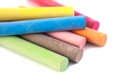 Colored chalks on white background with soft shadows Stock-Fotos