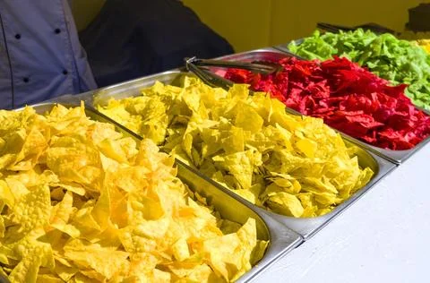 Colored chips. sale of chips. Multi-colored snacks. Concept unhealthy food. Stock Photos