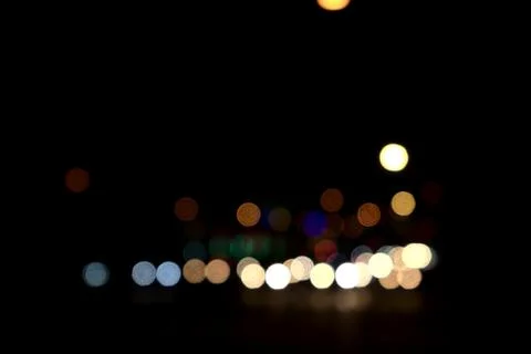 Colored circular blurred bokeh combination of transportation, car and light.. Stock Photos