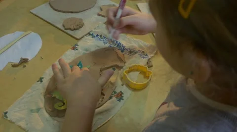 Colored Clay Picture on a Woaden Board is Made by a Laborious Six Year Old Video stock 59124592