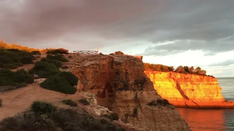 Colored cliffs from twilight on the coast of Grutas de Benagil in Portugal. Stock Footage 132029426