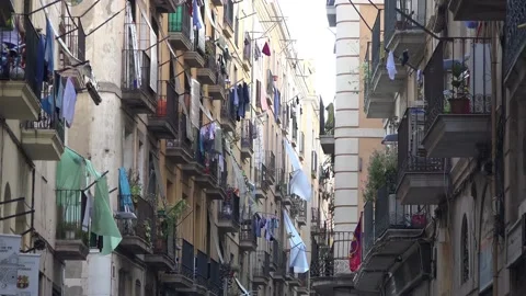 Colored clothes drying on the balcony of an old house. Narrow streets. Video stock 140398953