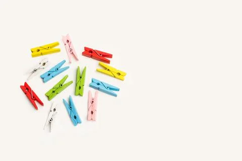 Colored clothespins on gray background Stock Photos