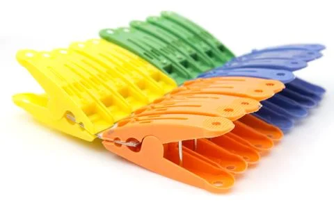 Colored clothespins on white background Stock Photos