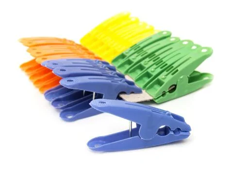 Colored clothespins on white background Stock Photos