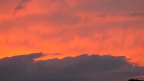 Colored clouds at sunset. Panning 4K Stock Footage 165463041