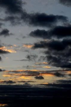 Colored clouds at sunset Stock Photos