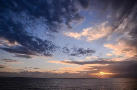 Colored clouds at sunset Stock Photos