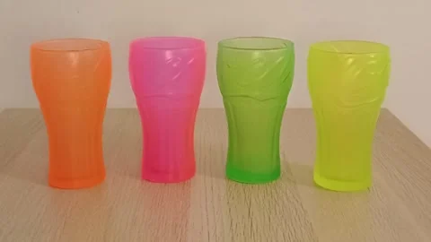 Colored Coca Cola glasses 6 June 2026 Marina di Carrara Italy Stock Footage 336460708