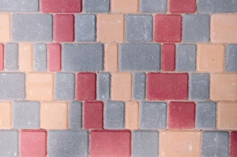 Colored concrete tile texture close-up. Colorful background of stones. Stock Photos