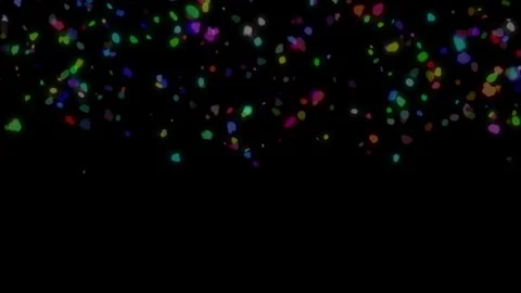 Colored confetti fall from the sky on a dark background Stock Footage 246538768