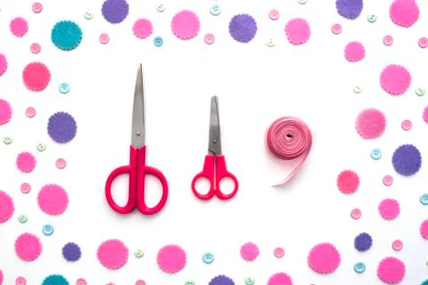 Colored confetti on white background flat lay top view. Stock Photos