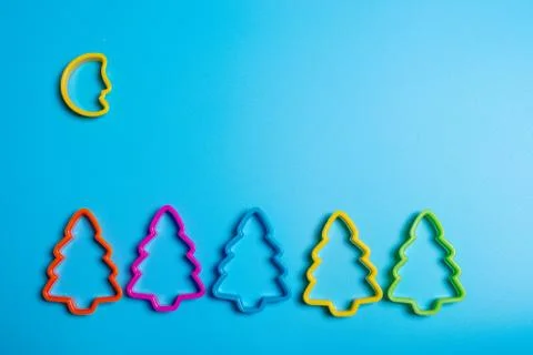 Colored cookie cutters for the preparation of a five Christmas tree and the m Stock Photos