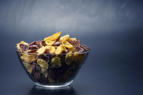 Colored corn flakes in a bowl Stock Photos