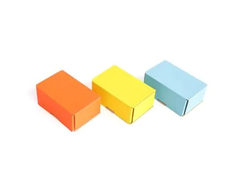 Colored craft boxes on a white background. Orange, blue, yellow. Place for .. Foto stock