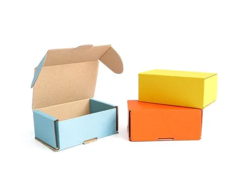 Colored craft boxes on a white background. Orange, blue, yellow. Place for .. Stock Photos