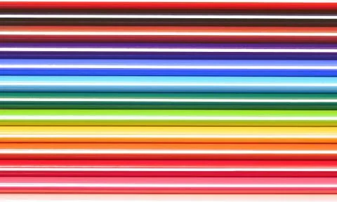 Colored crayons background Stock Photos