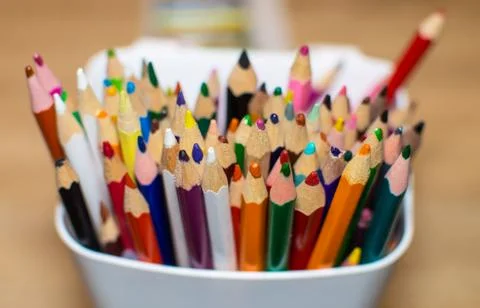 Colored crayons in a box Stock Photos