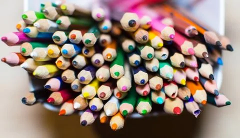 Colored crayons in a box Stock Photos