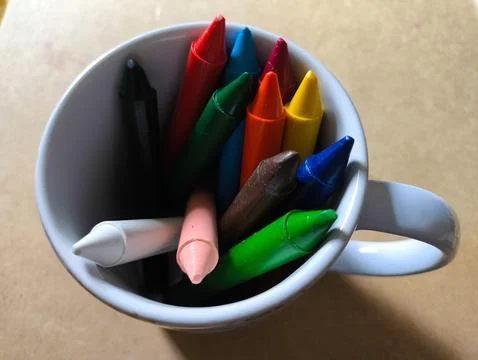 Colored crayons inside a mug Stock Photos