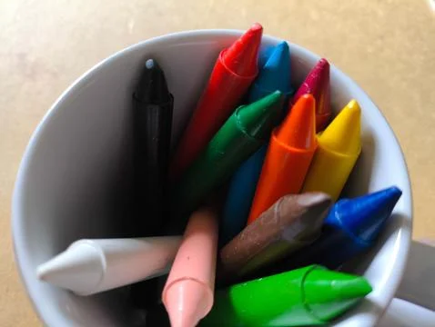 Colored crayons inside a mug Stock Photos