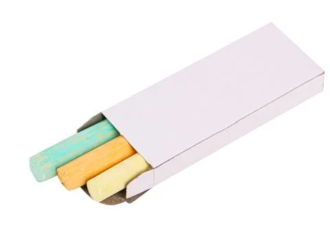 Colored crayons in a white box on a white background, isolated image Stock Photos