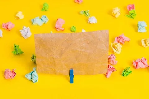 Colored crumpled sheets placed around the empty rectangle square shaped re... Stock Photos
