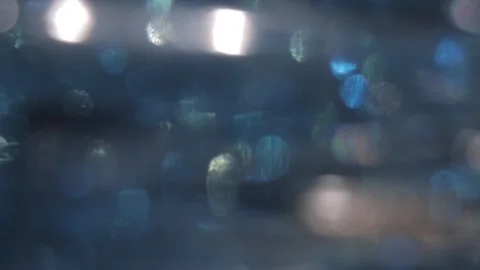 Colored crystal bokeh streaks light leakage from full-screen glass Vídeo Stock 318137634