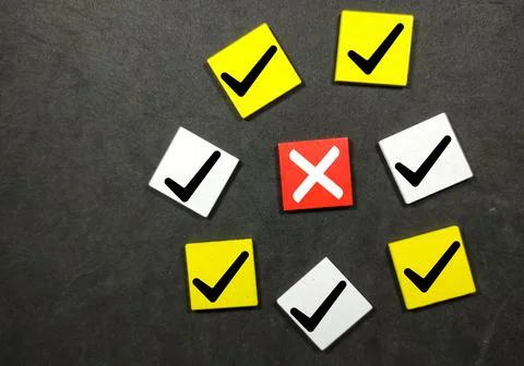 Colored cube with a correct sign and one incorrect sign. The concept of check Stock Photos