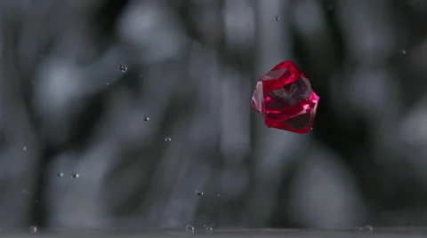 Colored cubes falling and bouncing on puddle, Slow Motion Stock Footage 31819401