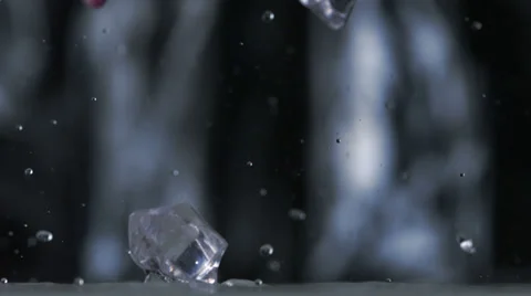 Colored cubes falling and bouncing on puddle, Slow Motion Stock Footage 31819558