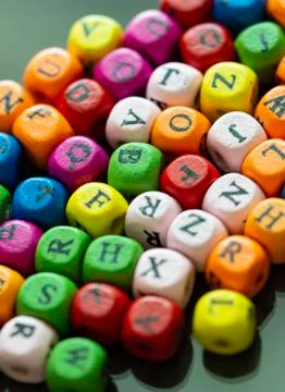 Colored cubes with letters. Multi-colored alphabet macro photography. Wooden  Stock Photos