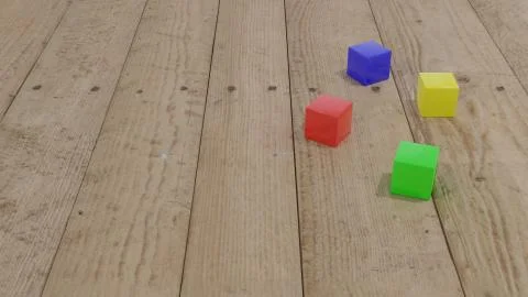 Colored cubes on wooden surface. 3d rendering Stock Illustration