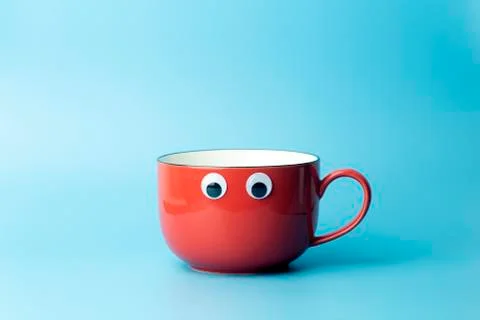 Colored cup on an empty colored background, minimal concept background. Home  Stock Photos