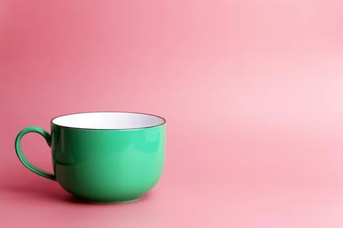 Colored cup on an empty colored background, minimal concept background. Home  Stock Photos