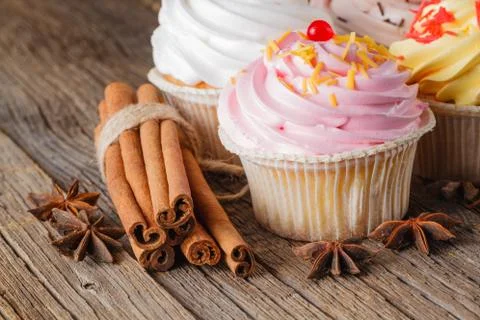 Colored cupcake on rustic background Foto stock