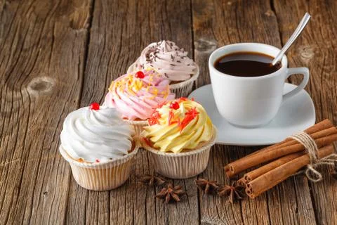 Colored cupcake on rustic background Stock Photos