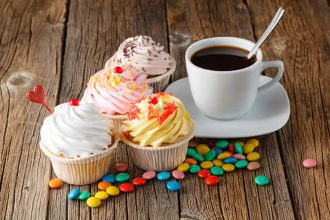 Colored cupcake on rustic background Foto stock