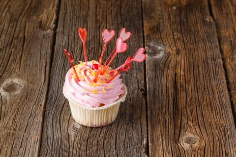 Colored cupcake on rustic background Foto stock