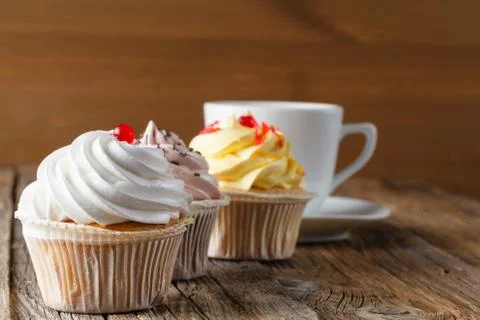 Colored cupcake on rustic background Stock Photos