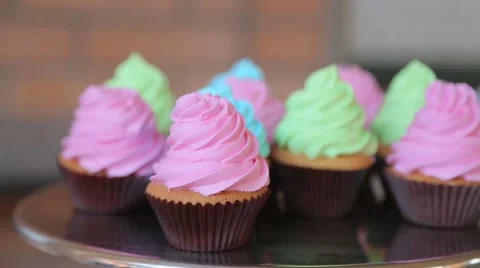 Colored cupcakes on a tray Stock Footage 59802474