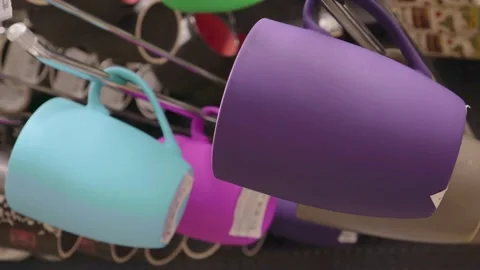 Colored cups in store purple cyanide price tag choice Vídeos de archivo 147654540