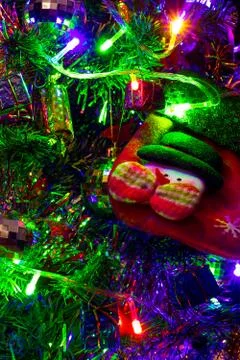Colored decoration of Christmas tree with empty sock, close up. Stock Photos