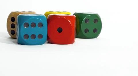 Colored dice on white background. Copy space. Stock Photos