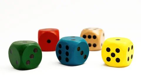 Colored dice on white background. Copy space. Stock Photos