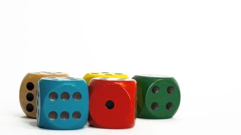 Colored dice on white background. Copy space. Stock Photos